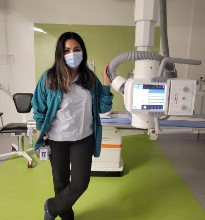 person stand with medical imaging equipment
